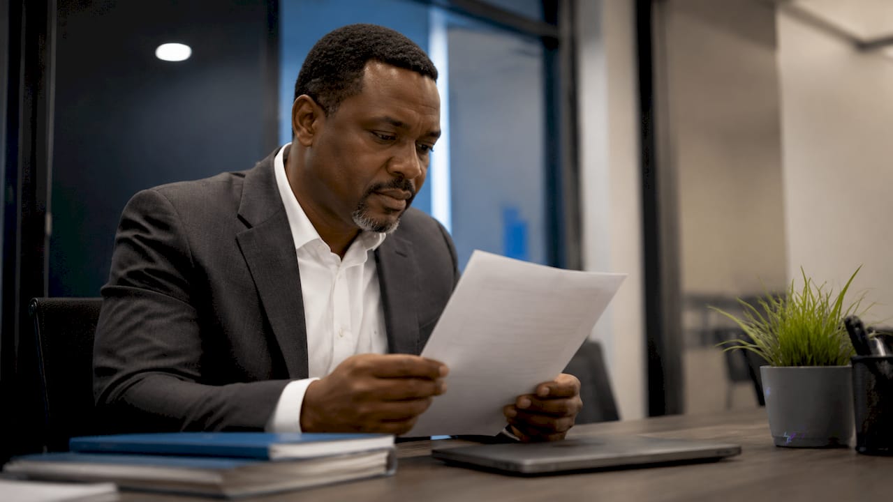 Recruiter examining resume document